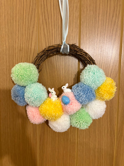Handmade pastel Easter bunny door wreath by The PomPom Lodge